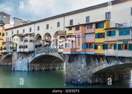 Ponte Vecchio in Florence, Italy, with colorful riverside shops Stock Photo
