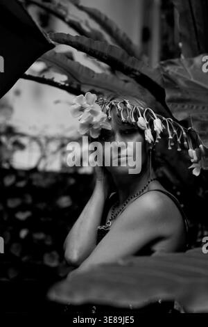 Black and white portrait woman with flowers in hair, Bali, Indonesia Stock Photo