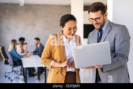 Success business people with laptop. Analytics, developer for startup business website IT software Stock Photo
