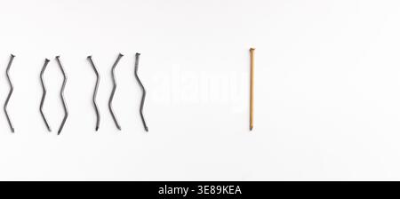Collection of Nails Showing Different Shapes and Sizes on a Plain Background Stock Photo