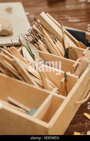 Assorted Clay Tools in Wooden Organizer for Ceramics Stock Photo