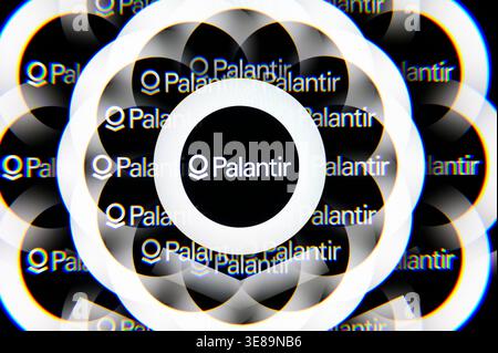 Paris, France - April 10, 2026: The Palantir Technologies logo displayed through a kaleidoscopic lens filter, creating a repetitive pattern. Stock Photo