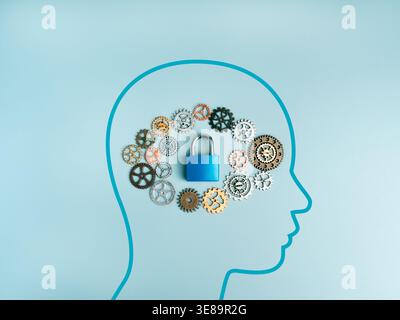 Cybersecurity and data protection, mental health concept with human head shape, gears, and padlock. Secure thinking, privacy protection, encryption, a Stock Photo