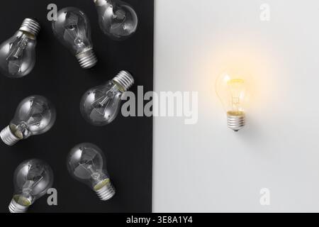 Illuminated lamp separated from other on contrast background Stock Photo