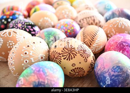 Assortment of vibrant easter eggs displaying intricate traditional patterns and designs. Stock Photo