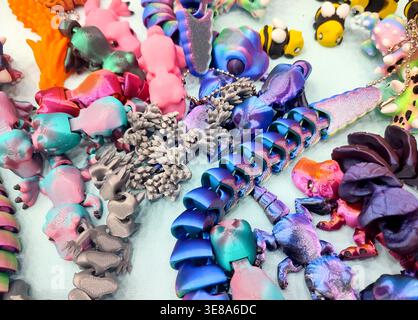 3D printed different art objects. Objects printed on 3D printer from melted colored plastic. Multicolored models created on 3D printer from threads of molten plastic. Modern new additive technologies Stock Photo