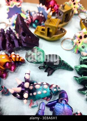 3D printed different art objects. Objects printed on 3D printer from melted colored plastic. Multicolored models created on 3D printer from threads of molten plastic. Modern new additive technologies Stock Photo