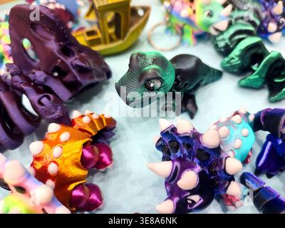 3D printed different art objects. Objects printed on 3D printer from melted colored plastic. Multicolored models created on 3D printer from threads of molten plastic. Modern new additive technologies Stock Photo