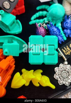 3D printed different art objects. Objects printed on 3D printer from melted colored plastic. Multicolored models created on 3D printer from threads of molten plastic. Modern new additive technologies Stock Photo