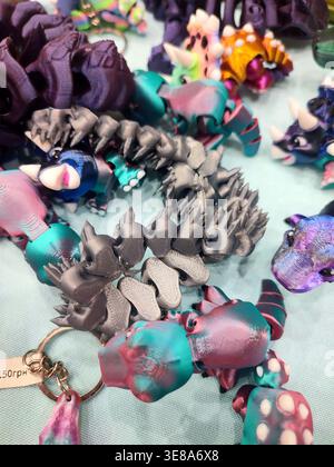 3D printed different art objects. Objects printed on 3D printer from melted colored plastic. Multicolored models created on 3D printer from threads of molten plastic. Modern new additive technologies Stock Photo