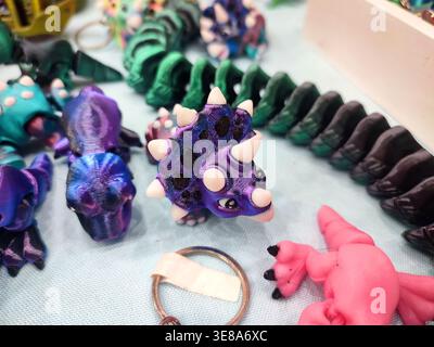 3D printed different art objects. Objects printed on 3D printer from melted colored plastic. Multicolored models created on 3D printer from threads of molten plastic. Modern new additive technologies Stock Photo