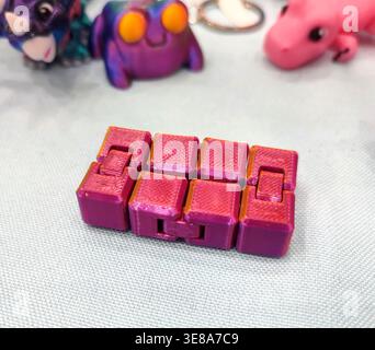 3D printed different art objects. Objects printed on 3D printer from melted colored plastic. Multicolored models created on 3D printer from threads of molten plastic. Modern new additive technologies Stock Photo