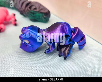 3D printed different art objects. Objects printed on 3D printer from melted colored plastic. Multicolored models created on 3D printer from threads of molten plastic. Modern new additive technologies Stock Photo