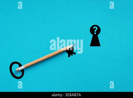 Pencil shaped like a key moving towards a question mark keyhole on blue background, concept of finding answers and creative problem solving Stock Photo