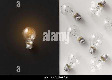 Illuminated lamp separated from other on contrast background Stock Photo