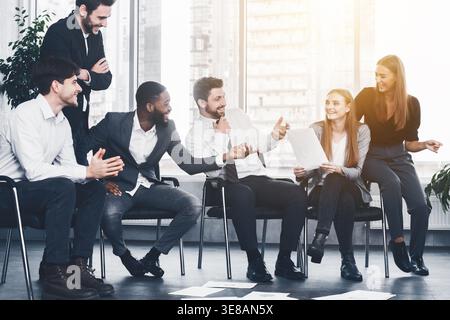 Business team discussing ideas at meeting in office Stock Photo