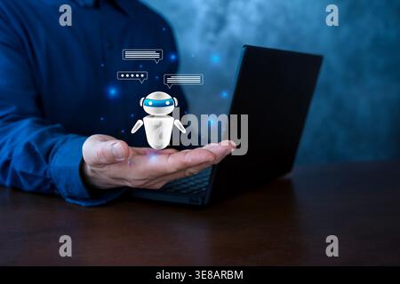 Business user presents a floating AI chatbot above the hand beside a laptop, symbolizing virtual assistance, automated messaging, customer support, an Stock Photo