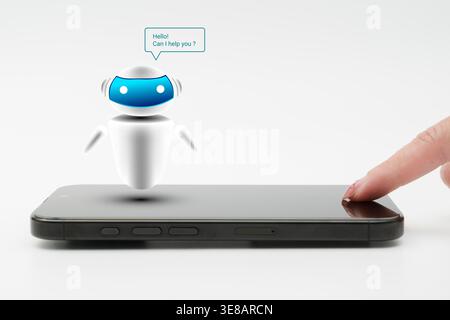 A finger taps a smartphone as a friendly AI chatbot appears above the screen, illustrating mobile virtual assistance, automated support, conversationa Stock Photo