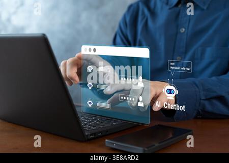 Business user interacting with a laptop-based AI chatbot interface, illustrating automated customer support, live messaging, virtual assistance, and d Stock Photo