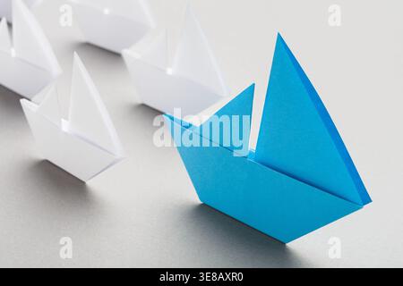 Collection of Paper Boats in Various Shapes and Sizes on a Flat Surface in a Simple Arrangement Stock Photo