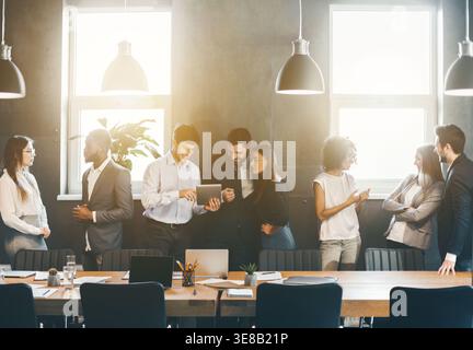 Business people discussing new project plans during break Stock Photo