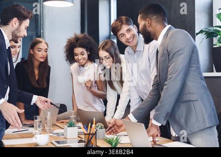 Business professionals. Group of colleagues analyzing data using computers Stock Photo