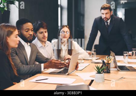 Group discussion. Colleagues discussing new project at meeting Stock Photo