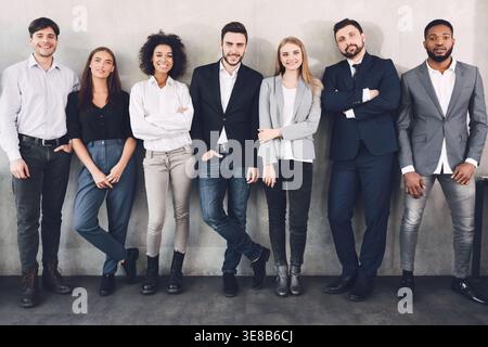 Young business colleagues smiling together to camera Stock Photo