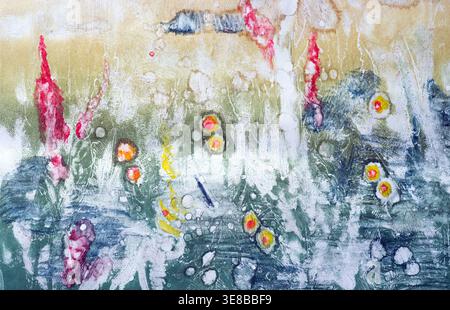 Abstract watercolor painting featuring organic shapes, floral elements, and vibrant splashes on textured paper. Stock Photo