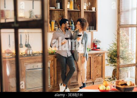 Young loving couple having good time at christmas morning Stock Photo