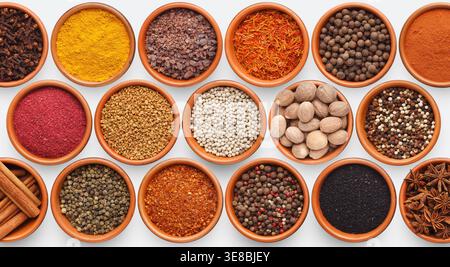 Different kinds of spices on white background Stock Photo
