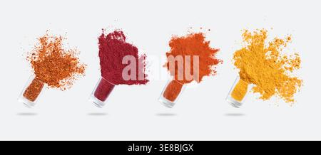 Glass jars with various spices flying on white background Stock Photo