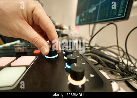 knob audio video mixing console live stream broadcast production Professional equipment adjusting sound level multimedia studio workspace modern techn Stock Photo