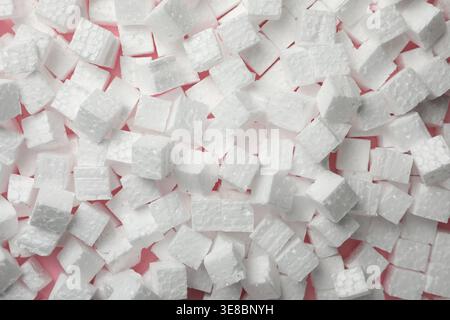 Many styrofoam cubes on pink background, top view Stock Photo