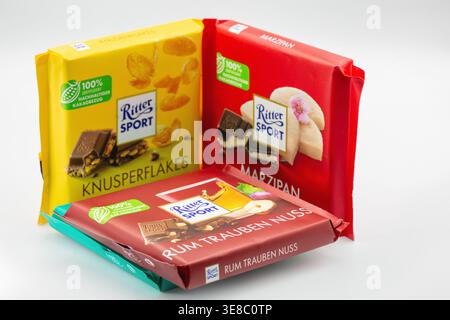 Kyiv, Ukraine - January 28, 2026: Ritter Sport chocolate bars in different flavors including marzipan and nuts. Bright packaging closeup on white, con Stock Photo