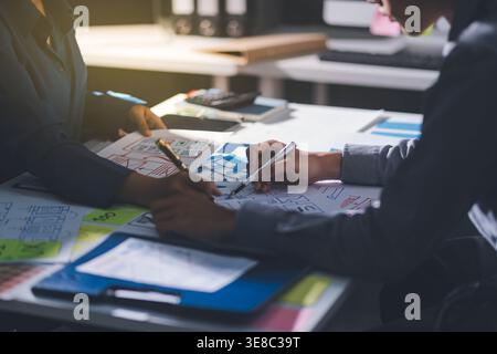 Team of Program Developer Collaborating on UXUI Design Planning in a Modern Office Environment Stock Photo