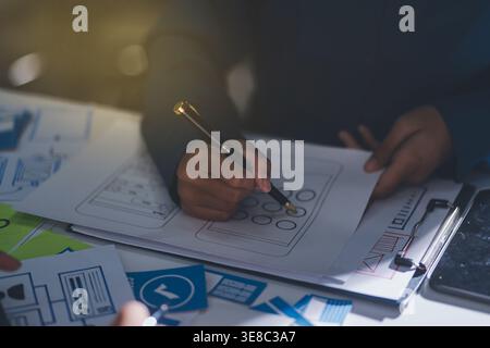 Team of Program Developer Collaborating on UXUI Design Planning in a Modern Office Environment Stock Photo