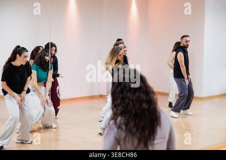 Diverse group of dancers practicing choreography in studio Stock Photo