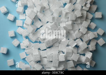 Many styrofoam cubes on light blue background, flat lay Stock Photo