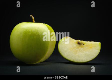 Fresh Green Apple with Slice on Black Background, Juicy Healthy Fruit Macro Close-Up Stock Photo