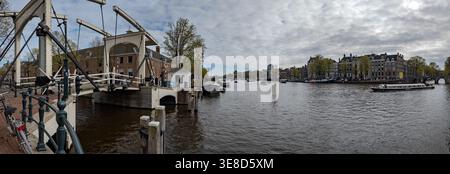 AMSTERDAM, NETHERLANDS - APRIL 1, 2026: The historic Walter Süskind drawbridge over the Amstel River under a cloudy spring sky Stock Photo