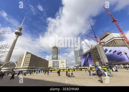 View of Alexanderplatz in Berlin. Covivio Tower and The Berlinian construction sites. Megaposter advertising poster and a tram. TV tower. Berlin, Germ Stock Photo