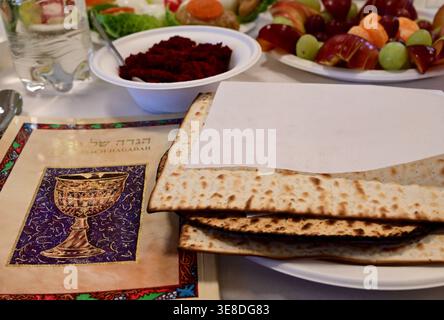 A table set for Passover with matzah, wine and fruit Stock Photo