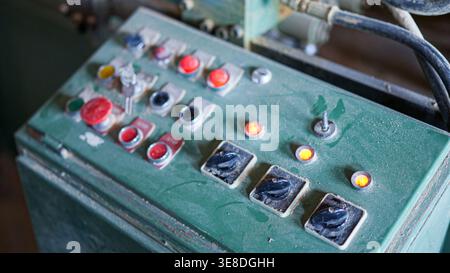Old industrial machinery control panel with buttons and switches Stock Photo