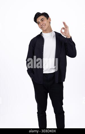Stylish man showing peace gesture on white background Stock Photo