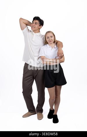 Happy couple standing together and posing in the studio Stock Photo