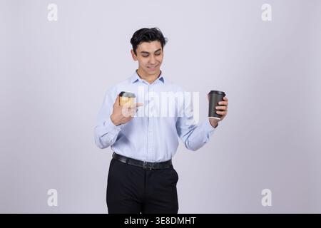 Man holding two paper coffee cups on white background Stock Photo