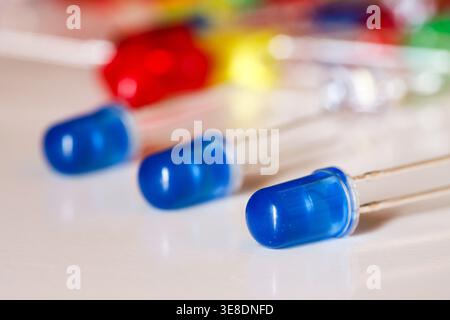 Blue LED diodes close-up on white background with shallow depth of field Stock Photo