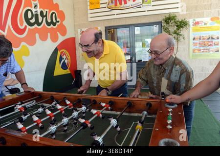 An exciting game of Foosball ( Table soccer / football ) in Lisbon, Portugal. Stock Photo