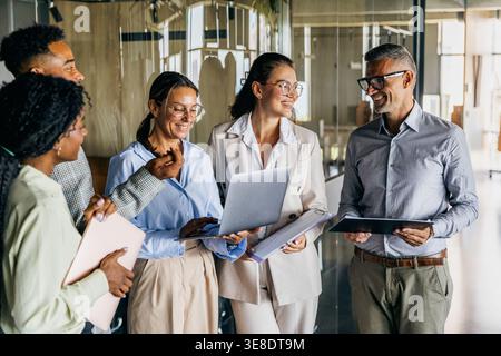 Unstructured office meetup with ideas sharing and positive atmosphere Stock Photo